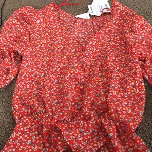 Red shirt with flowers